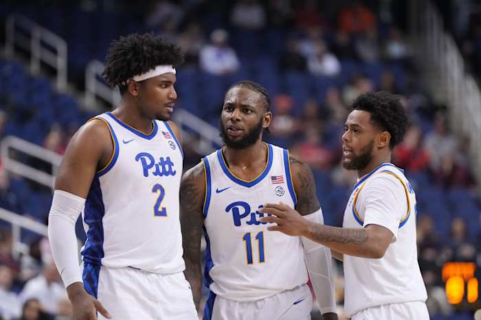Pittsburgh Panthers forward Blake Hinson (2) and Pittsburgh Panthers guard Jamarius Burton (11) and Pittsburgh Panthers guard Nelly Cummings (0) huddle in the second half of the second round at Greensboro Coliseum.
